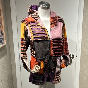 Vibrant Patchwork Hooded Jacket with Purple and Orange Accents